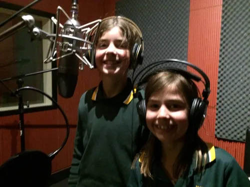 Bella and Alex recording in the studio